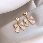 BOW GOLD HEART EARRINGS